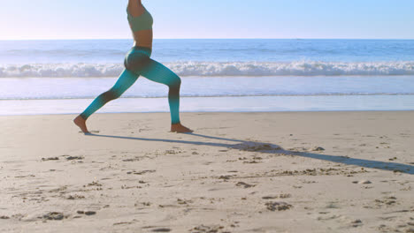 Woman-performing-yoga-in-the-beach-4k