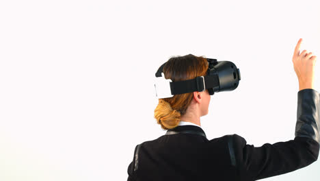 Business-woman-using-virtual-reality-headset-against-white-background-4k