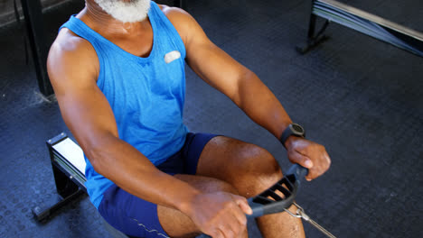Senior-man-working-out-on-rowing-machine-4k