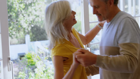 Senior-couple-dancing-on-the-porch-at-home-4k