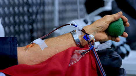 Senior-man-donating-blood-in-blood-bank-4k