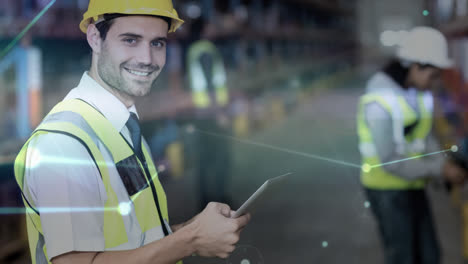 Handsome-young-warehouse-worker-working-on-tablet
