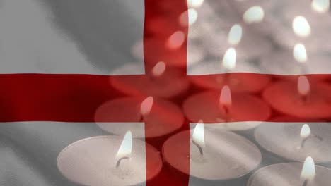 English-flag-with-candles-being-blown-out-in-the-background