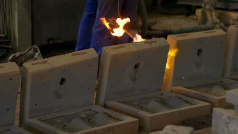 Male-worker-heating-molds-in-workshop-4k