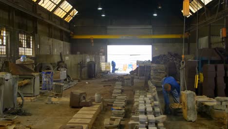 Worker-operating-crane-in-foundry-workshop-4k-