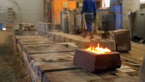 Molten-metal-being-turned-into-molds-in-workshop-4k