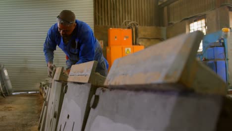 Worker-making-mold-in-foundry-workshop-4k
