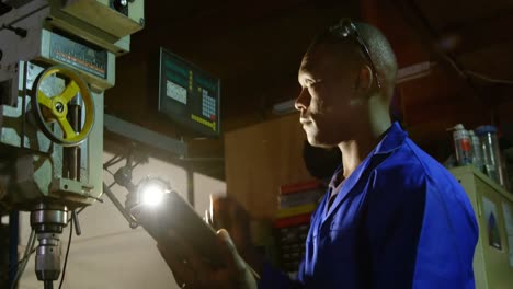 Male-worker-using-digital-tablet-in-glass-factory-4k