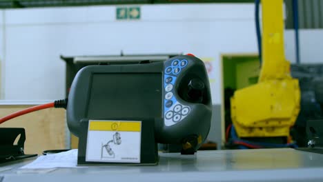Close-up-of-robotic-remote-control-in-warehouse-4k