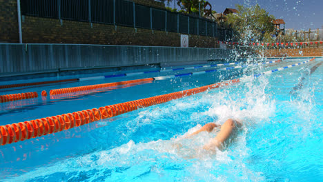 Female-swimmer-swimming-in-pool-4k