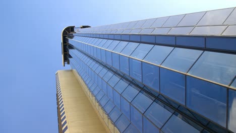 Low-angle-view-of-modern-office-building-4k