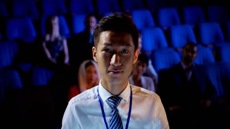 Young-Asian-businessman-attending-business-seminar-in-auditorium-4k