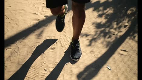 African-American-male-runner-jogging-near-beach-4k