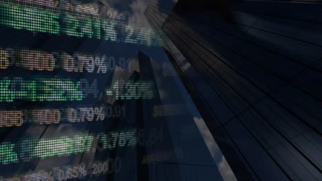 Stock-data-projected-against-skyscrapers-on-Wall-street-in-New-York-City