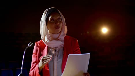 Businesswoman-with-hijab-speaking-in-business-seminar-at-auditorium-4k