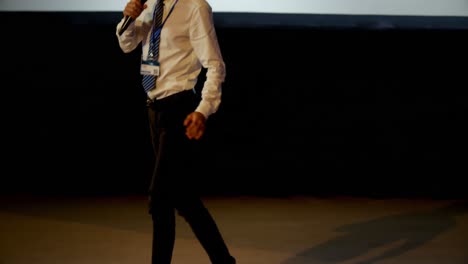 Young-Asian-businessman-speaking-in-business-seminar-at-auditorium-4k