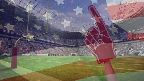 American-Football-Fan-Verwendet-Roten-Schaumstofffinger,-Um-American-Football-Spieler-Und-Amerikanische-Flagge-Zu-Unterstützen