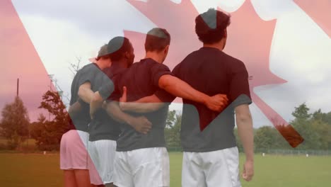 Rugby-team-standing-on-the-field-with-a-Canadian-flag-