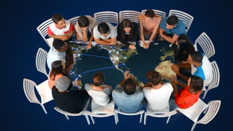 A-group-of-people-in-a-table-and-world-map