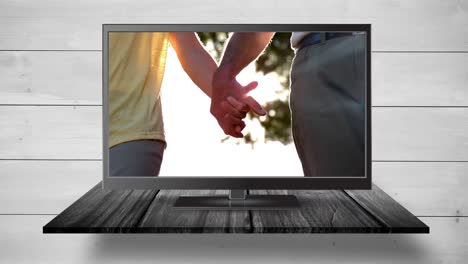Fernseher-Mit-Händchenhalten-Auf-Dem-Bildschirm