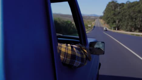 Young-man-on-a-road-trip-in-pick-up-truck
