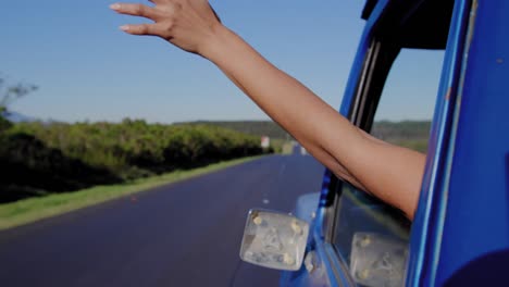 Young-woman-on-a-road-trip-in-pick-up-truck
