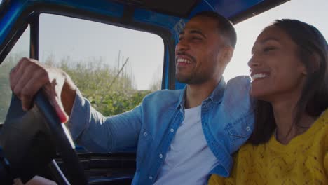 Young-couple-on-a-road-trip-in-their-pick-up-truck
