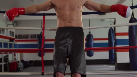 Caucasian-man-resting-in-boxing-ring