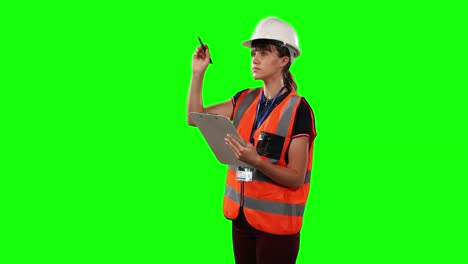 Front-view-of-a-site-forewoman-counting-with-green-screen