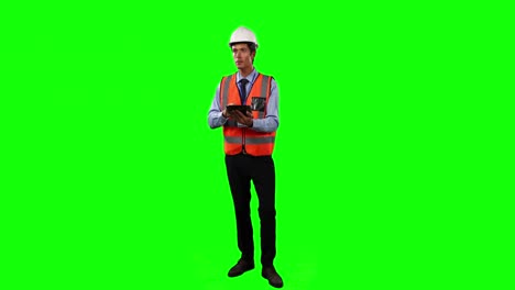 Front-view-of-a-site-foreman-using-digital-tablet-with-green-screen