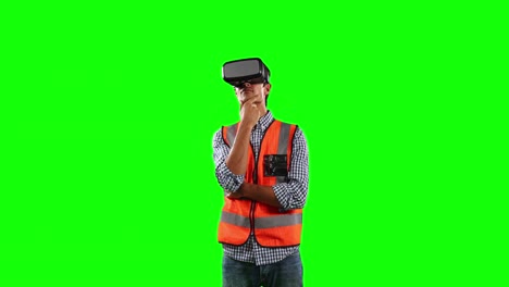 Front-view-of-site-worker-using-virtual-reality-with-green-screen