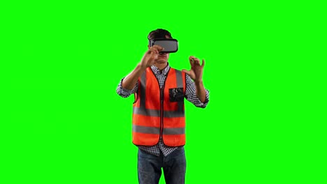 Front-view-of-a-site-worker-using-virtual-reality-with-green-screen
