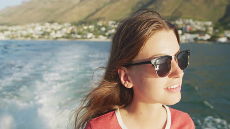 Side-view-of-a-teenage-Caucasian-girl-enjoying-her-time-on-a-boat