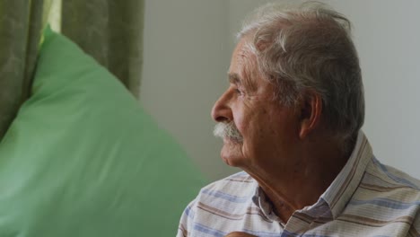 Senior-man-in-social-distancing-in-retirement-house
