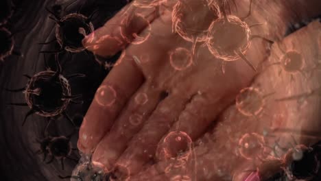 Animation-Von-Makro-Coronavirus-Covid-19-Zellen,-Die-Sich-Aus-Den-Händen-Eines-Kaukasischen-Mannes-Ausbreiten