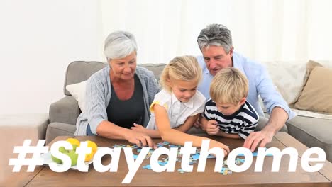 Animation-of-the-words-~-Stay-at-home-over-happy-grandparents-with-their-grandchildren-at-home