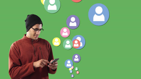 Animation-of-mixed-race-man-smiling-and-using-his-smartphone-with-colorful-people-icons-floating-o