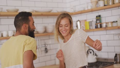 Cute-couple-dancing-together-at-home