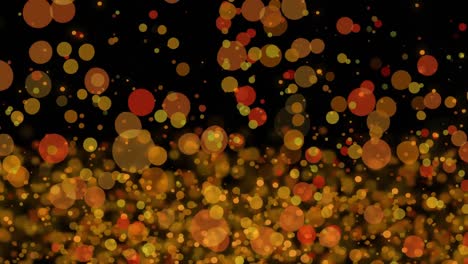 Yellow-and-orange-glowing-spots-moving-against-black-background-