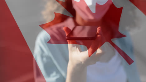 Canadian-flag-waving-against-woman-wearing-face-mask