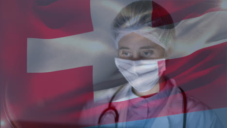 Swiss-flag-waving-against-female-doctor-wearing-face-mask