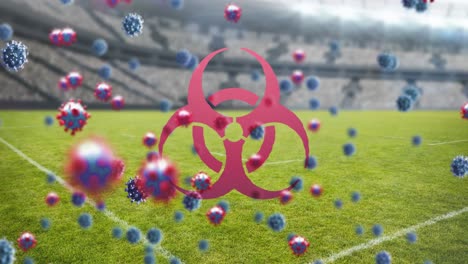 Biohazard-symbol-and-Covid-19-cells-against-empty-sports-stadium