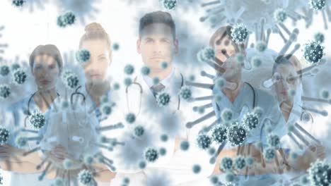 Animation-of-3d-covid-19-cells-floating-over-portrait-of-group-of-doctors