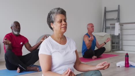 Diverse-group-of-seniors-taking-part-in-meditation-class