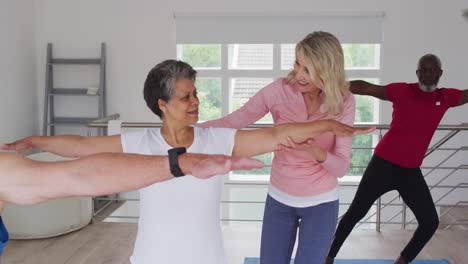 Diverse-group-of-seniors-taking-part-in-fitness-class