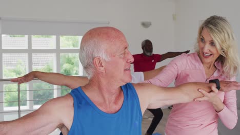 Diverse-group-of-seniors-taking-part-in-fitness-class