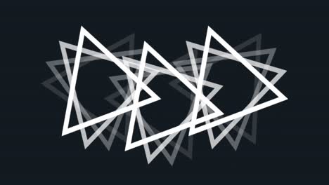 Animation-of-multiple-white-triangles-spinning-on-seamless-loop-over-black-background