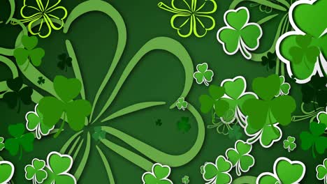 Animation-of-multiple-clover-leaves-on-green-background