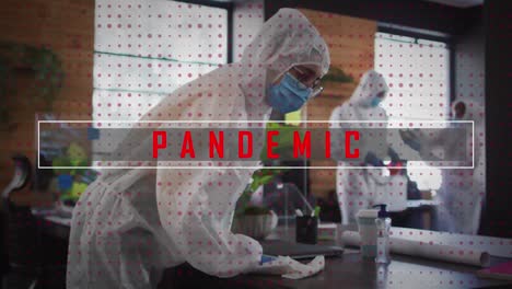 Pandemic-text-against-team-of-health-workers-spraying-disinfectant-at-office