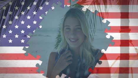 Animation-of-american-flag-jigsaw-puzzles-revealing-smiling-woman-on-beach